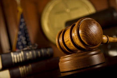 Gavel at a Courtroom Desk