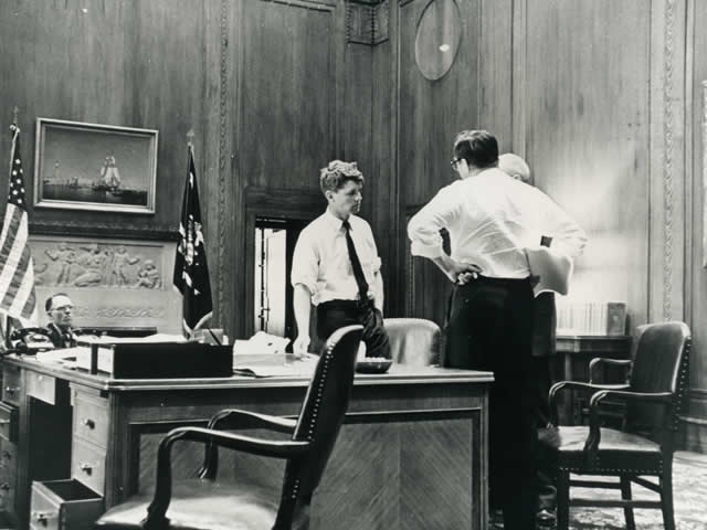 Attorney General Robert F. Kennedy meets with advisors in his office at the Department of Justice.