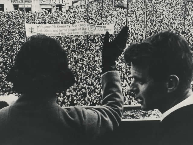 Mrs. Ethel Kennedy waves to the crowd gathered in Berlin. Attorney General Robert F. Kennedy is by her side.