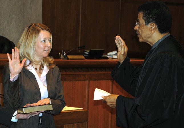 U.S. Attorney Beth Phillips and U.S. Chief District Judge Fernando J. Gaitan