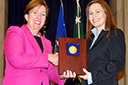 Acting Assistant Attorney General Sharis Pozen presents a 2011 Assistant Attorney General Award to Christine Hill.