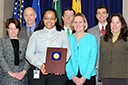 Foreign Commerce/International Team members accept a 2011 Assistant Attorney General Team Award. (L-R) Emily Chen, Maureen Casey, Caldwell Harrop, Tracy Shorter, Ed Hand, Anne Purcell White, Patrick Kibbe, Nancy Olson, Andrea Agathoklis, Rachel Brandenburger, and Paul O’Brien.