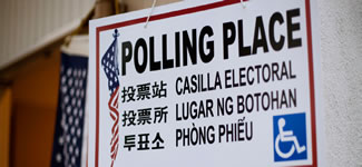 photograph of a multilingual polling place sign