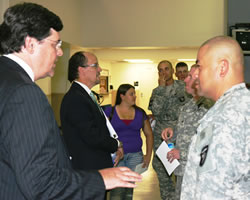 photograph of servicemembers with Assistant Attorney General Perez and U.S. Attorney Hale