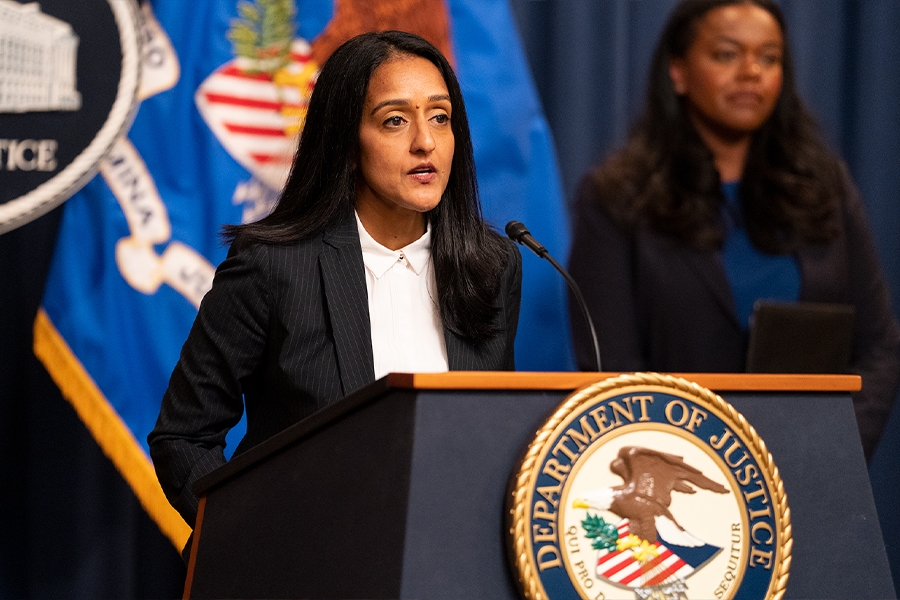 Associate Attorney General Vanita Gupta delivers remarks from a podium bearing The Department of Justice seal.