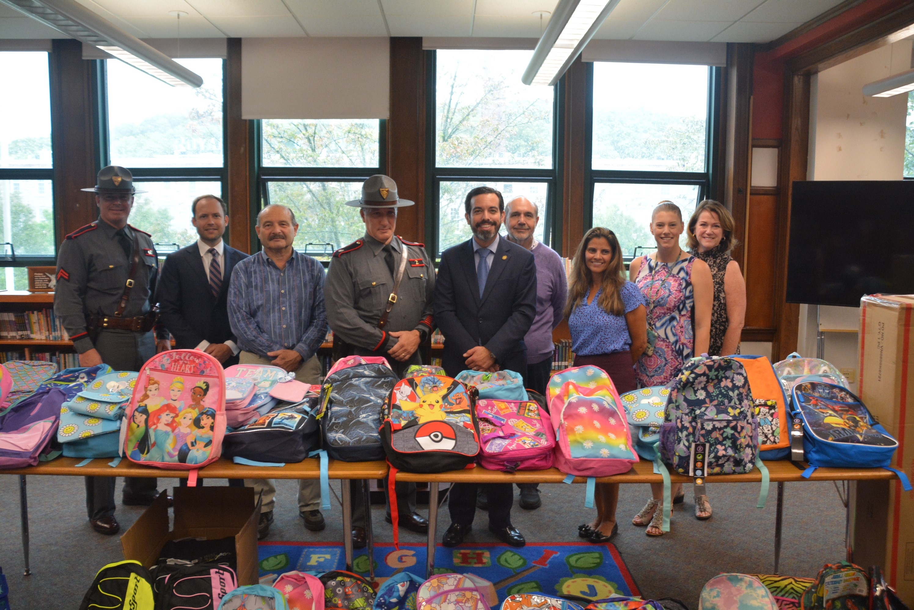 U Attorney Cunha joined state and federal law enforcement and community organizations to present hundreds of backpacks filled with school supplies to students across Rhode Island.