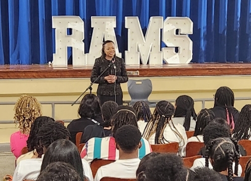 Assistant Attorney General Clarke speaking to students at Ramsay IB High School. 