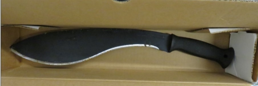 Una imagen que muestra un machete con mango negro y hoja curva.
