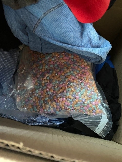 Photo is of seized rainbow-colored, pressed fentanyl pills.  