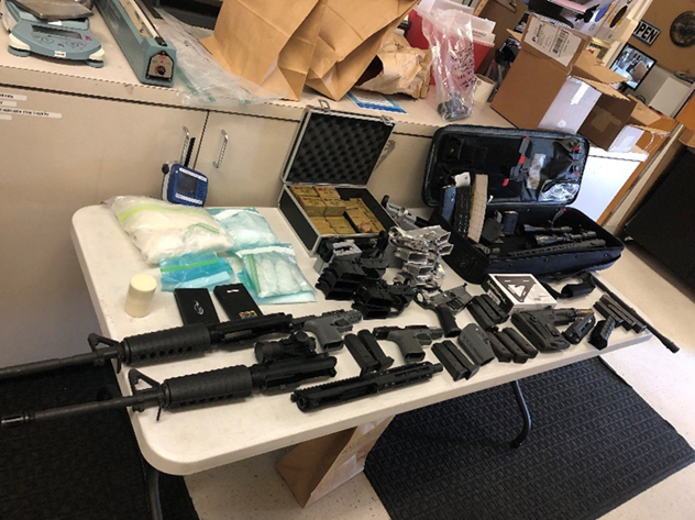 Multiple AR-style firearms, parts, pistols, magazines, unfinished firearm parts used to create ghost guns, and a cache of Russian made ammunition.