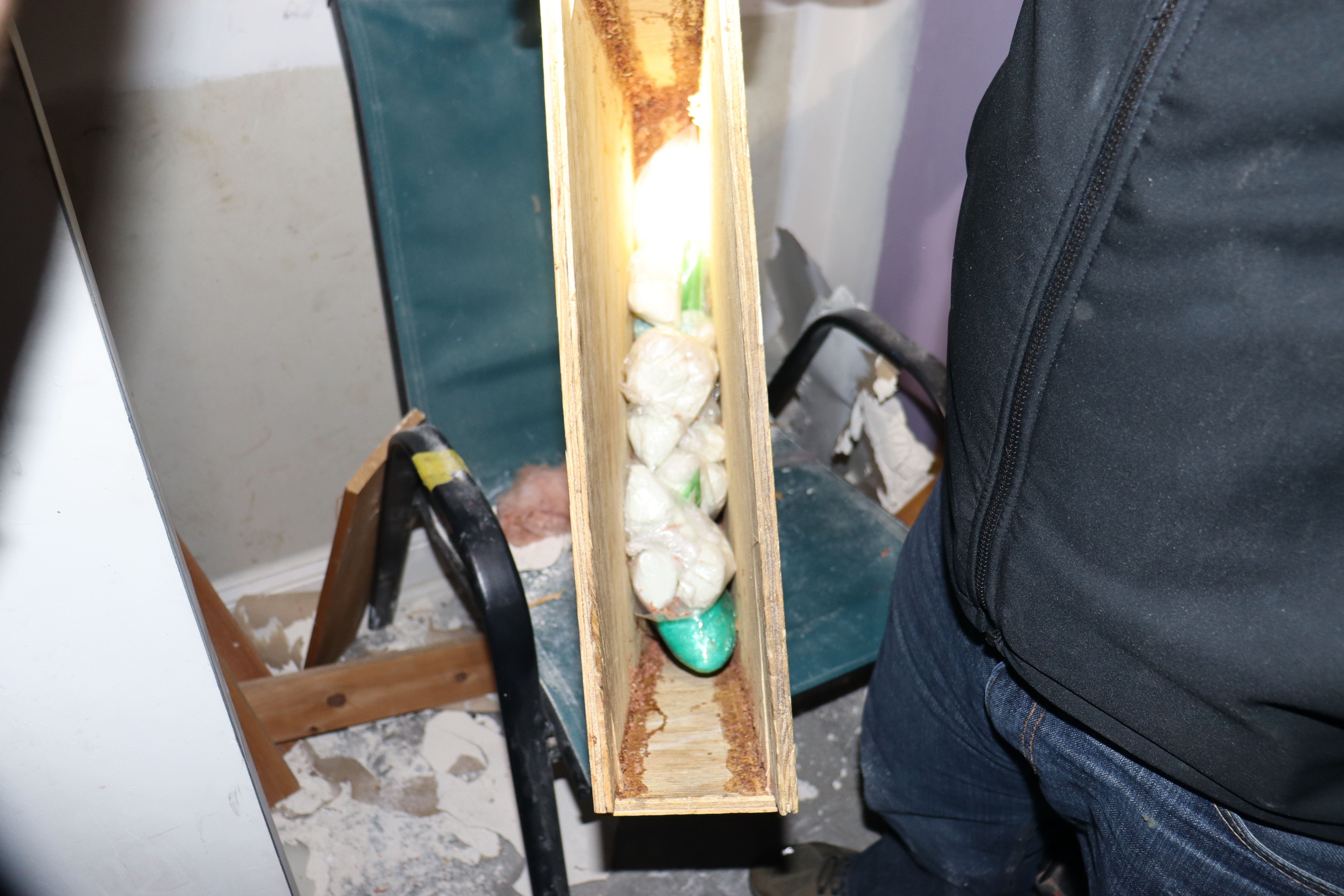 Drawer of white substance in plastic bags