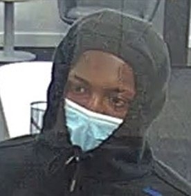 Image of man in hoodie wearing surgical mask