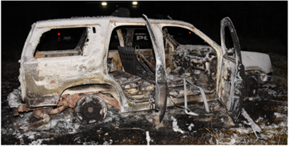 Image of the burned-out and abandoned car