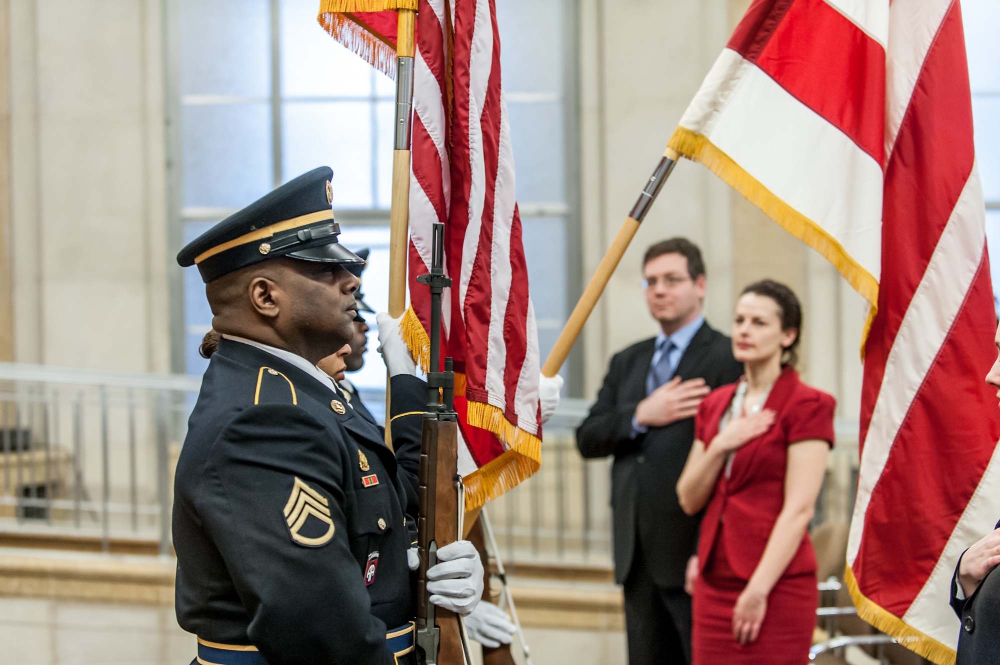 Guests stand for the National Anthem at the opening ceremony for the U.S. Department of Justice's Sunshine Week Celebration.
