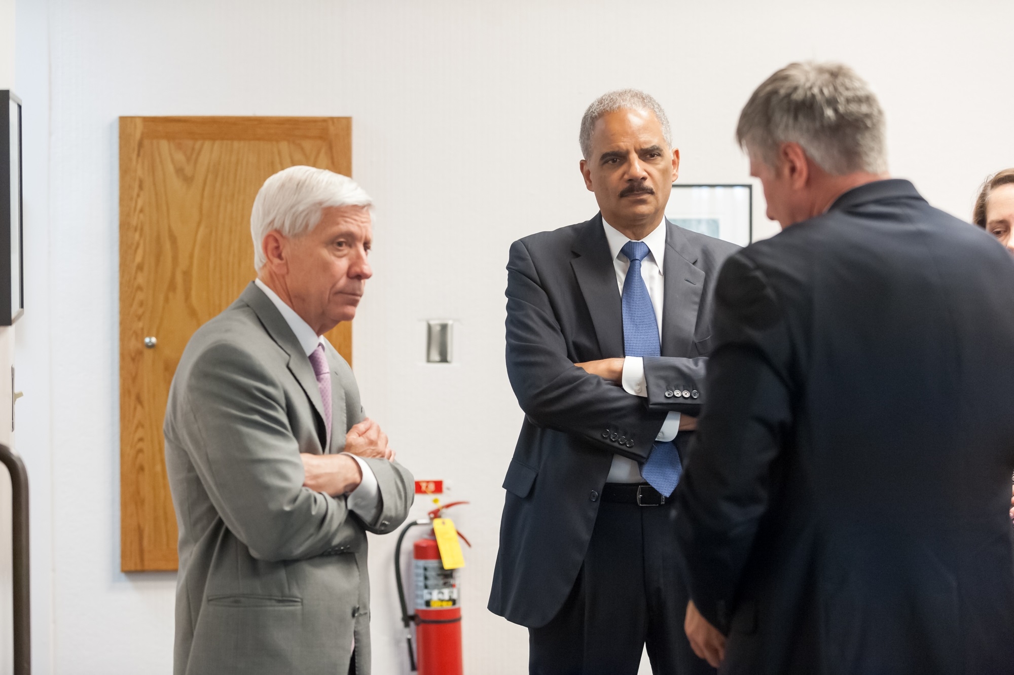 AG Eric Holder speaks with U.S. Attorney Richard Callahan and DAAG Mark Kappelhoff for the Civil Rights Division.