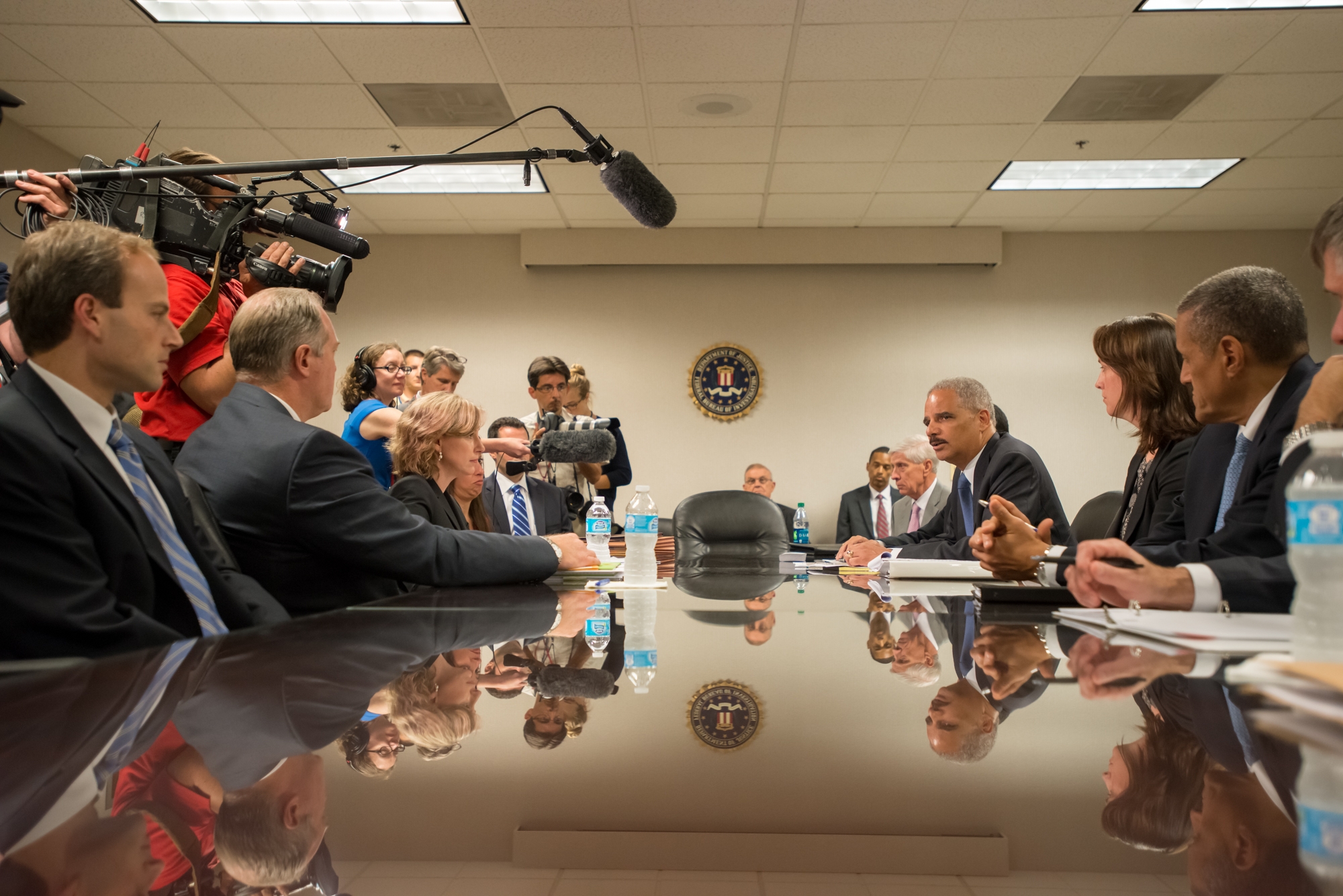 AG Eric Holder receives a briefing at the FBI on the independent civil rights investigation into the death of Michael Brown.