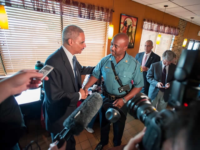 Attorney General Eric Holder meets with Missouri Highway Patrol  Captain Ron Johnson at Drake's Place restaurant.