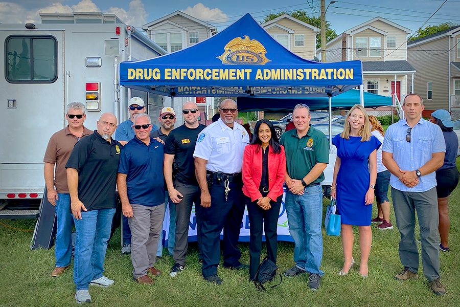 Associate Attorney General Vanita Gupta stands with DEA officials at National Night Out in Richmond, V.A.