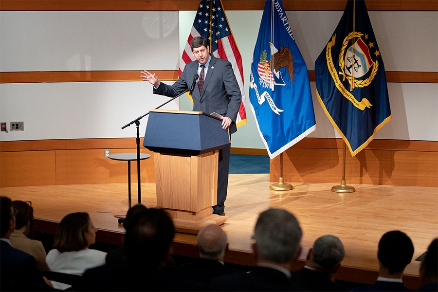 ATF Director Steven M. Dettelbach delivers remarks from a podium at the Bureau of Alcohol, Tobacco, Firearms and Explosives headquarters in Washington, D.C.