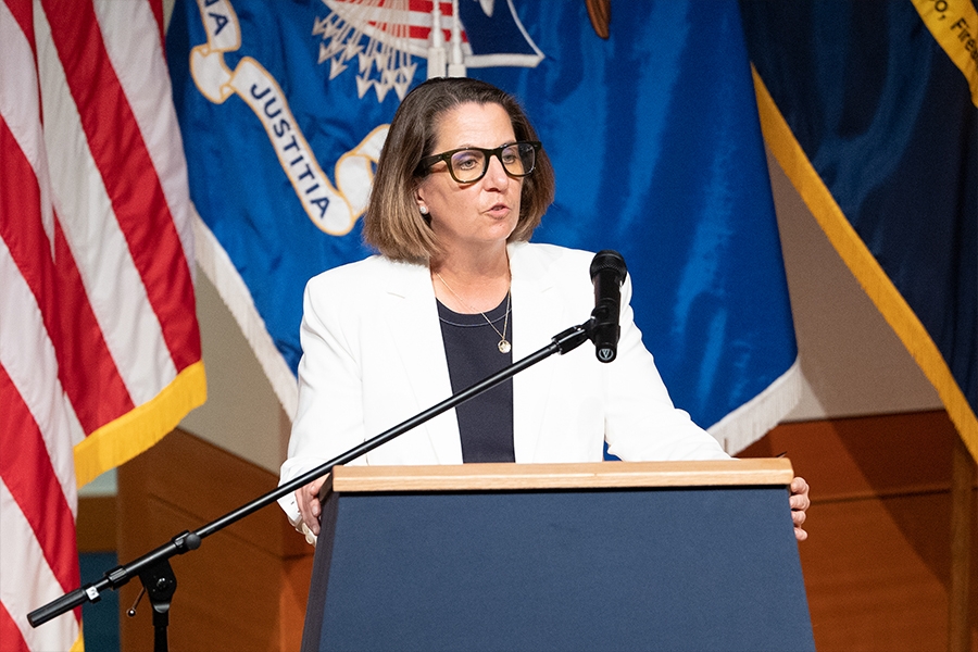 Deputy Attorney General Lisa O. Monaco delivers remarks from a podium at the Bureau of Alcohol, Tobacco, Firearms and Explosives headquarters in Washington, D.C.