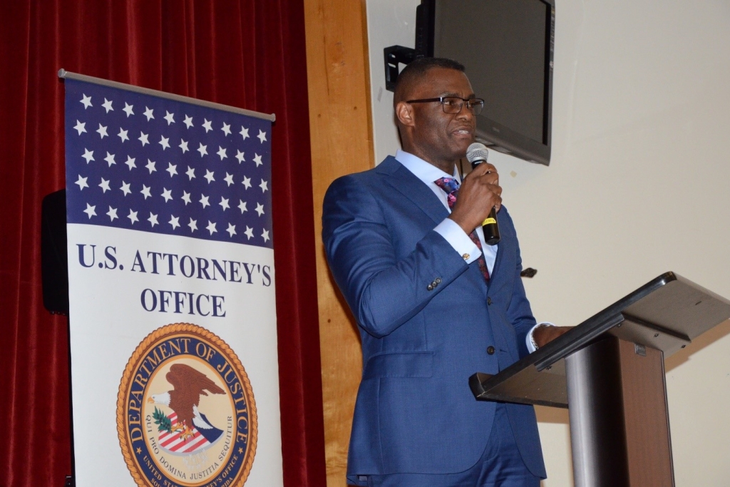 U.S. Attorney for the Southern District of Florida Markenzy Lapointe speaks to a group of community members and Miami Edison Senior High School students during a recent community engagement event. Lapointe, an Edison graduate himself, stressed the importance of education and making good decisions.