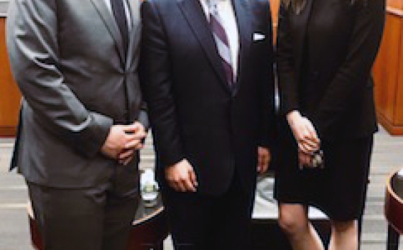 AAG Makan Delrahim (center) joined by George Washington University Law School Students