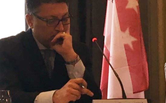 AAG Delrahim in front of microphone