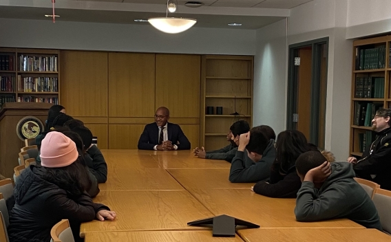 U.S. Attorney Damian Williams speaking to Forte Prep's debate club