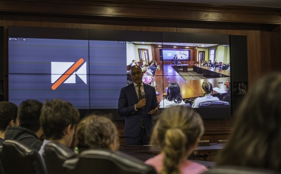 U.S. Attorney Damian Williams speaking to students participating in the Harlem Education Activities Fund Introduction to Law Class