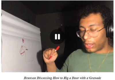 Screen grab of video showing man wearing headphones. Text reads: Brunson discussing how to rig a door with a grenade