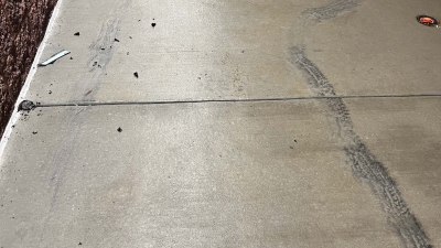 Evidence of tire markings on sidewalk