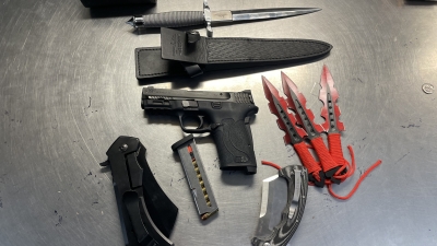 Picture of gun, knives, cash and other dangerous weapons