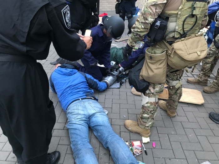FPS Officers Separate Demonstrators Connected at Wrist by "Sleeping Dragon" Device