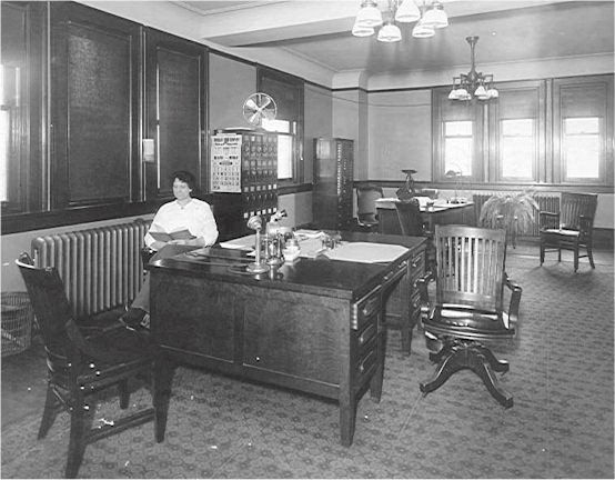 Picture of Ms. Backus at work in the office Picture of Ms. Backus at work in the office