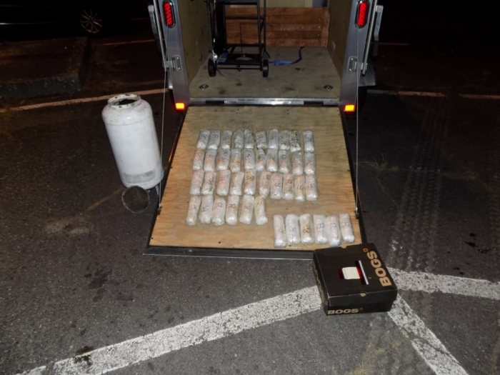 Meth displayed on a trailer ramp next to the propane tank with false bottom where it was found.