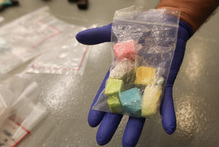 Photo of Bagged Rainbow Fentanyl in Hand for Scale