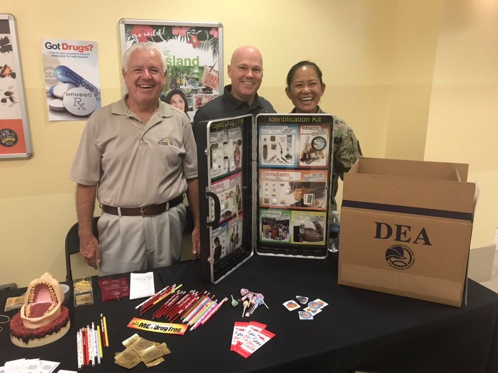 Picture of Monty McDowell, Chamber of Guam representative, Kirk Williamson, Special Agent with the DEA, and Sgt. Corina Andre with the Guam Army National Guard