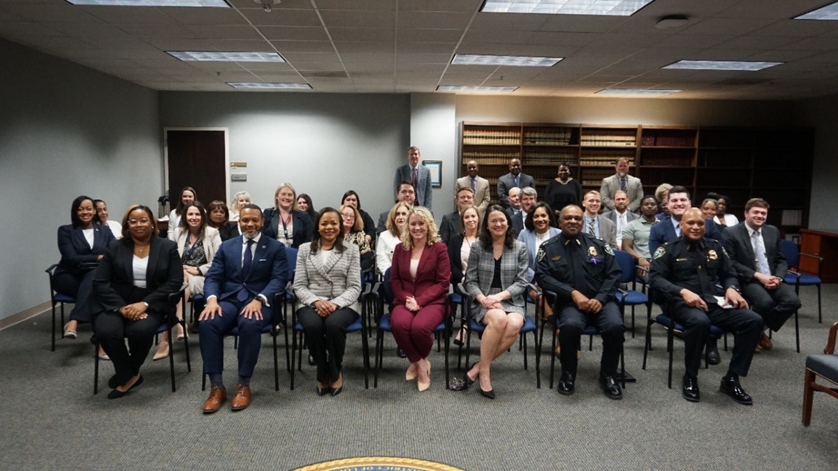 Assistant Attorney General Clarke and U.S. Attorney Brown with Western District of Louisiana staff in the Shreveport office and Shreveport Chief of Police Wayne Smith and Deputy Chief Antoine White.