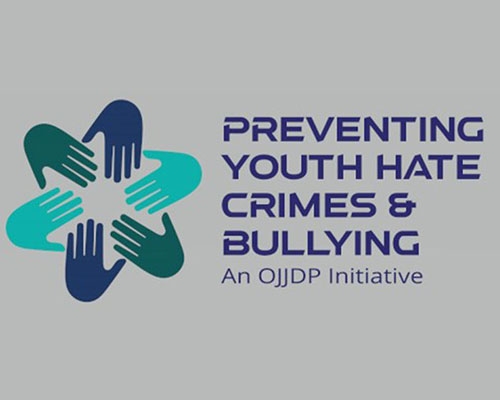 A graphic showing hands together in a circle. Text: Preventing Youth Hate Crimes & Bullying. An OJJDP Initiative.