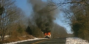 image of u-haul getaway van burning on roadside 