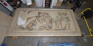 Mosaic (on a floor) dating from the Roman Empire that depicts a story from ancient Greek and Roman mythology depicting Hercules rescuing Prometheus, who had been chained to a rock by his fellow gods for stealing fire for humanity.