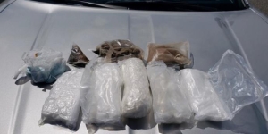 Bags of seized heroin, methamphetamine, and fentanyl in clear bags