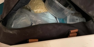 Photo of duffle bag and pills inside