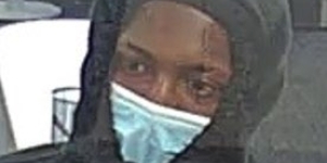 Image of man in hoodie wearing surgical mask