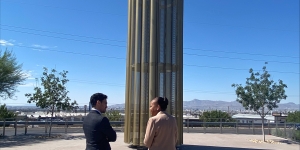 Assistant Attorneys General Clarke and Uriarte view the memorial at the Cielo Vista Walmart.