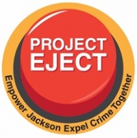 Red eject button with the words "Project Eject" written on the top and Empower Jackson Expel Crime Together under the button