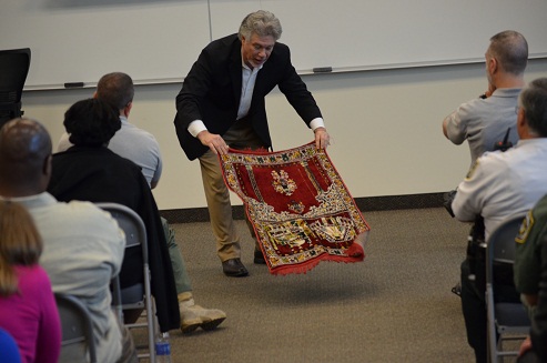 Co-trainer Alexander Kronemer demonstrates Muslim practices to the group